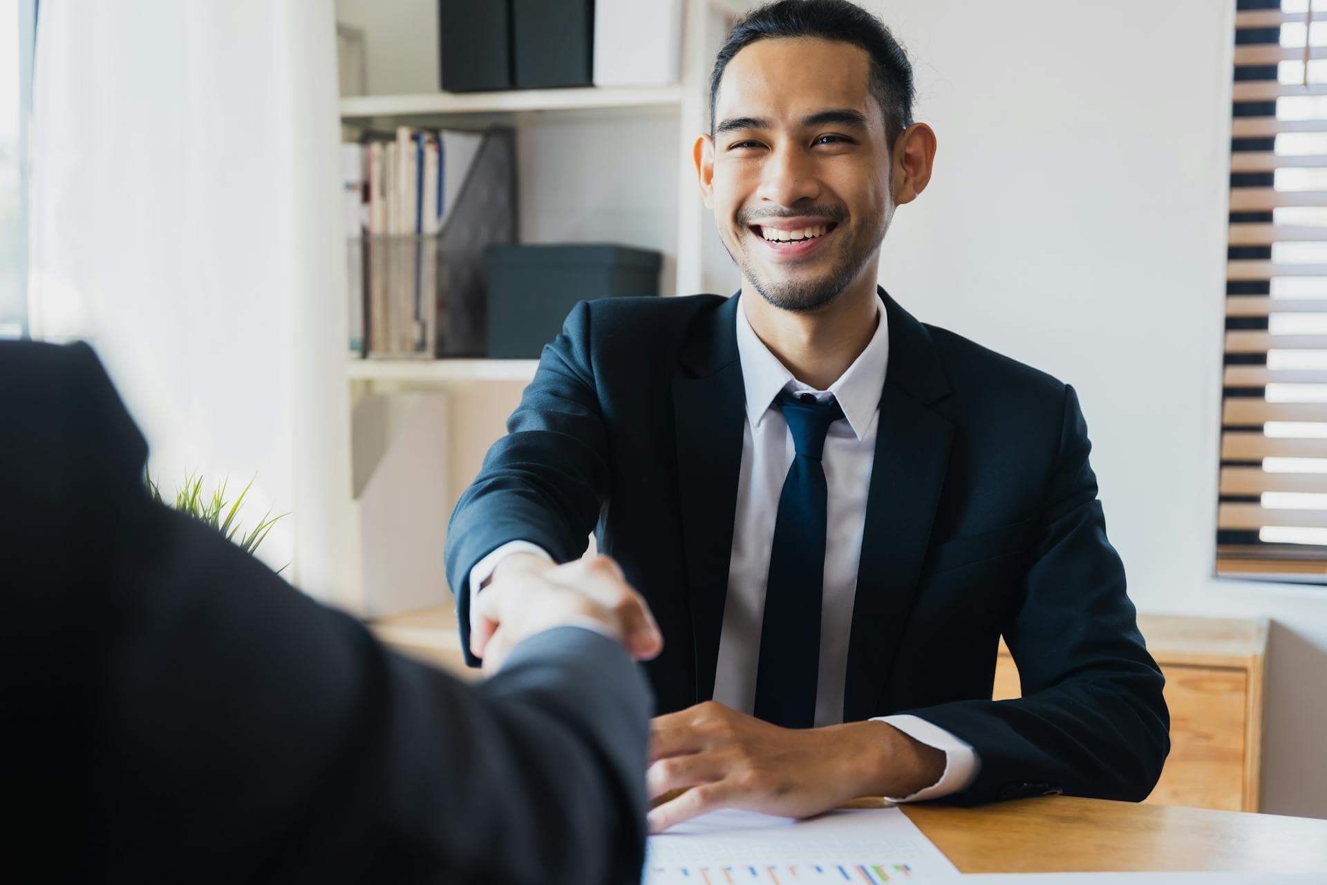 Person negotiating salary using charts and data